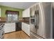Bright kitchen showcasing stainless steel appliances and modern cabinetry at 18206 E Tanforan Pl, Aurora, CO 80015