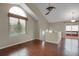 Bright living room with wood floors and large window with view of the trees outside at 18206 E Tanforan Pl, Aurora, CO 80015