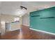 View of the open living space featuring hardwood floors, neutral walls and staircase at 18206 E Tanforan Pl, Aurora, CO 80015