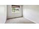 Bedroom with neutral walls and carpet, a window with a shade, and a functional space at 5651 S Himalaya Way, Centennial, CO 80015