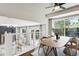 Dining room area with hardwood floors open to the living room and a view of the backyard at 5651 S Himalaya Way, Centennial, CO 80015