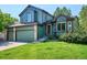 Charming two-story home with a three-car garage and mature landscaping at 5651 S Himalaya Way, Centennial, CO 80015
