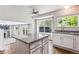 Kitchen island with granite countertop and sink open to the living room and a window overlooking the backyard at 5651 S Himalaya Way, Centennial, CO 80015