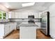 Beautiful updated kitchen with island, granite countertops and stainless appliances at 5651 S Himalaya Way, Centennial, CO 80015
