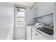 Laundry room with a window, shelves, and a washer and dryer at 5651 S Himalaya Way, Centennial, CO 80015