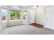 Bright, unfurnished living room with hardwood floors and large windows at 5651 S Himalaya Way, Centennial, CO 80015