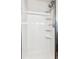 All-white shower stall with built-in shelves and a modern shower head, providing a clean and functional space at 5651 S Himalaya Way, Centennial, CO 80015