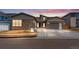 New construction home with stone accents and two-car garage at 14408 Hop Clover Trl, Parker, CO 80134