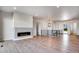 Bright and airy living room with fireplace and hardwood floors at 14408 Hop Clover Trl, Parker, CO 80134