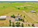 Aerial view of home highlighting large outbuilding, a three car garage and ample surrounding acreage at 14825 Almstead St, Hudson, CO 80642