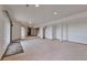 Expansive finished basement with recessed lighting, sliding door access, and versatile open space at 14825 Almstead St, Hudson, CO 80642