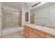 Functional bathroom featuring a tiled shower-tub combo, single sink vanity, and neutral finishes at 14825 Almstead St, Hudson, CO 80642