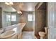 Bathroom features a unique countertop, two windows, neutral gray walls and tile flooring at 14825 Almstead St, Hudson, CO 80642