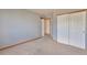 Cozy bedroom with soft carpeting, trim, and ample closet space, creating a comfortable retreat at 14825 Almstead St, Hudson, CO 80642