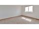 Bright bedroom featuring a large window offering natural light and a peaceful atmosphere at 14825 Almstead St, Hudson, CO 80642