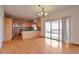 Open kitchen with wood cabinets, countertops, and sliding glass doors to the deck at 14825 Almstead St, Hudson, CO 80642