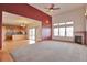 Bright living room with a fireplace and an open-concept kitchen at 14825 Almstead St, Hudson, CO 80642