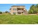 Home featuring a spacious backyard, deck, and walkout basement at 14825 Almstead St, Hudson, CO 80642