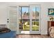 Enclosed balcony with comfortable seating and views of the surrounding landscape at 7020 E Girard Ave # 209, Denver, CO 80224