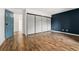 Spacious bedroom featuring hardwood floors and closet storage at 7020 E Girard Ave # 209, Denver, CO 80224