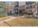 Multi-story condo building with well-maintained landscaping and inviting entryway at 7020 E Girard Ave # 209, Denver, CO 80224