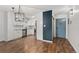 Bright kitchen with white cabinets and stainless appliances and open layout to living area at 7020 E Girard Ave # 209, Denver, CO 80224