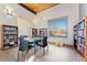 Library space with bookshelves, tables, chairs and bright, natural light at 7020 E Girard Ave # 209, Denver, CO 80224