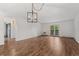Bright living area with wood floors, shiplap accent wall, and glass doors to outdoor deck at 7020 E Girard Ave # 209, Denver, CO 80224