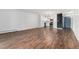 Open concept living area with spacious layout and natural light, and wood flooring at 7020 E Girard Ave # 209, Denver, CO 80224