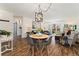 Open-concept living space with a dining area, living room, and sliding door access to outdoor space at 7020 E Girard Ave # 209, Denver, CO 80224