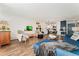 Inviting living space with comfortable seating, TV, kitchen, and dining area at 7020 E Girard Ave # 209, Denver, CO 80224