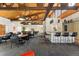 Community lounge with tables, chairs, pool table and a bar with stools at 7020 E Girard Ave # 209, Denver, CO 80224