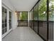 This sunroom/patio features floor-to-ceiling windows and a treelined view at 7020 E Girard Ave # 209, Denver, CO 80224