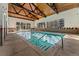 Inviting indoor pool with vaulted wood ceilings and large windows at 7020 E Girard Ave # 209, Denver, CO 80224