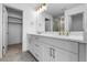 Modern bathroom boasts double sinks with gold fixtures and a glass-enclosed shower at 14261 Currant St, Broomfield, CO 80020