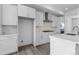 Bright, white kitchen featuring stainless steel appliances and a stylish range hood at 14261 Currant St, Broomfield, CO 80020