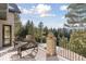 Deck overlooking lush forest, providing privacy and stunning mountain views at 26806 Evergreen Springs Rd, Evergreen, CO 80439
