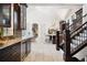 Spacious kitchen featuring dark wood cabinets, stainless appliances and plenty of storage and prep space at 26806 Evergreen Springs Rd, Evergreen, CO 80439