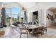 Bright and airy living room with soaring ceilings, large windows, and stylish furniture at 26806 Evergreen Springs Rd, Evergreen, CO 80439