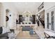Open-concept living and dining area featuring a modern design and staircase at 26806 Evergreen Springs Rd, Evergreen, CO 80439