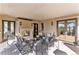Inviting covered patio with a stone fireplace, comfortable seating, and elegant decor for relaxing at 26806 Evergreen Springs Rd, Evergreen, CO 80439