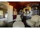 Cozy sitting room with built-in bookshelves and dark hardwood floors at 26806 Evergreen Springs Rd, Evergreen, CO 80439