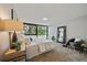Comfortable bedroom with natural light, soft carpet, and a calming decor for a relaxing atmosphere at 1050 N Corona St # 202, Denver, CO 80218