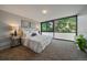 Inviting bedroom with neutral tones, large windows offering natural light, and a calming serene atmosphere at 1050 N Corona St # 202, Denver, CO 80218
