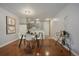Dining room featuring wood floors, a modern table set, and a convenient bar cart for entertaining guests at 1050 N Corona St # 202, Denver, CO 80218