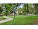 Exterior shot of a community park with walking path and mature trees at 1050 N Corona St # 202, Denver, CO 80218