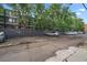 Apartment parking lot with numbered spots at 1050 N Corona St # 202, Denver, CO 80218