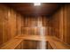 Wood paneled sauna room with upper and lower bench at 1050 N Corona St # 202, Denver, CO 80218