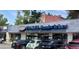 Storefront view of Snarf's Sandwiches with visible signage, outdoor seating, and customer parking at 1050 N Corona St # 202, Denver, CO 80218