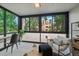 Cozy sunroom with ample natural light, comfortable seating, and a dedicated workspace, perfect for relaxation at 1050 N Corona St # 202, Denver, CO 80218